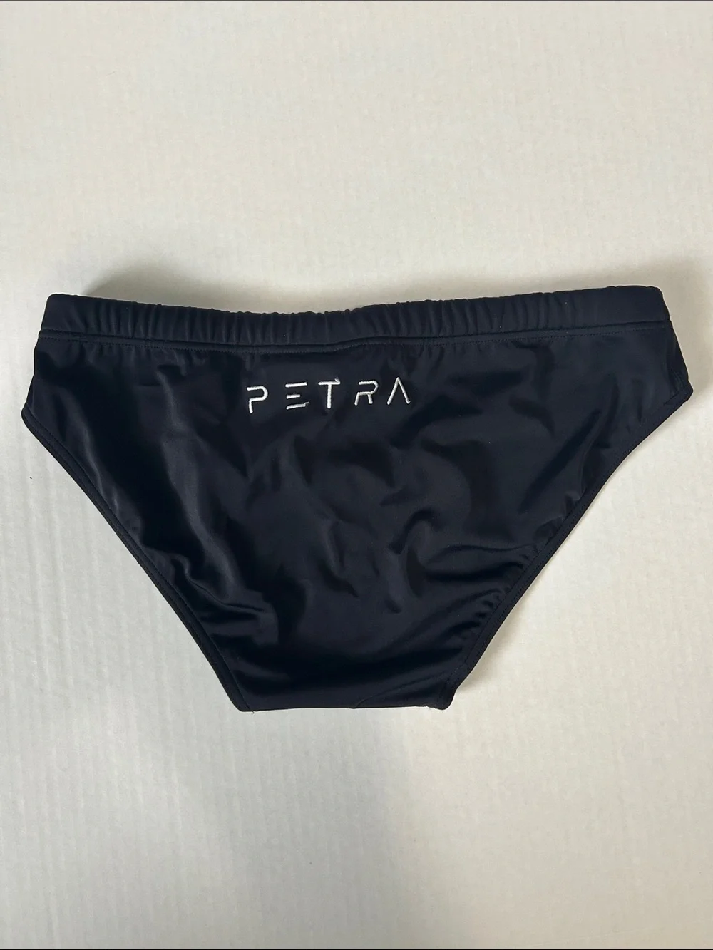Petra Fashions Black Swim Trunks with White Logo Accent